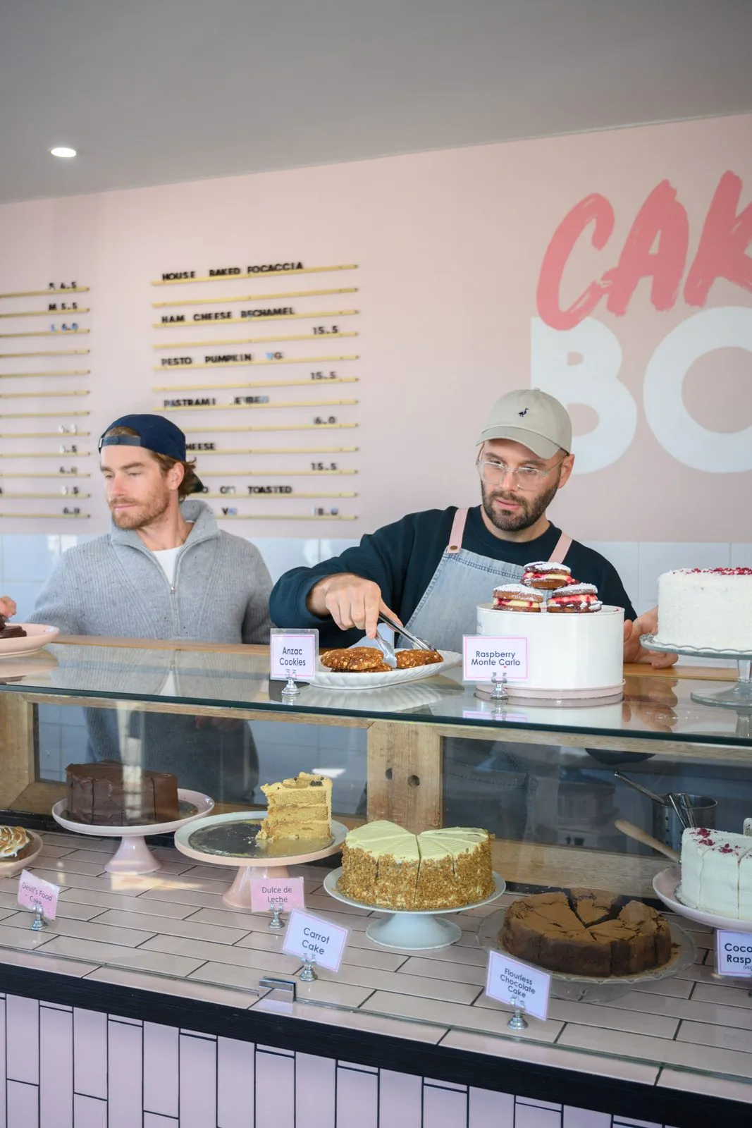 Hayden Quinn and Reece holding a cake