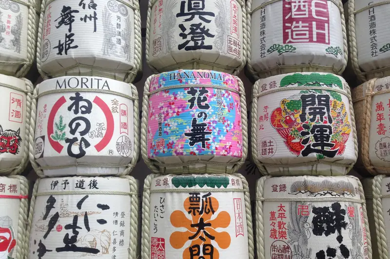 Rows of painted sake barrels stacked on top of each other